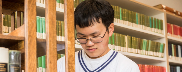 Photo of an adult student working in a UW Library.