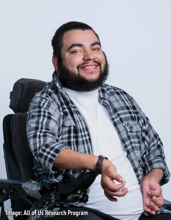 Image from All of Us Research Program website of a smiling man in a wheelchair.