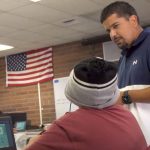 Video Screenshot: Teacher at Toppenish Middle School assisting a student.