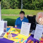 Photo: Grayson Hicks managing the information booth at the Buddy Walk.