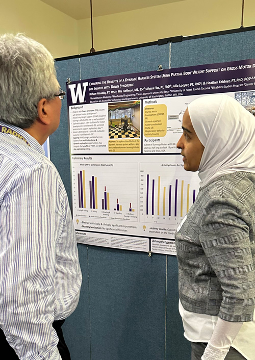 Photo: IHDD Research Day 2023 presenter explaining their poster presentation.