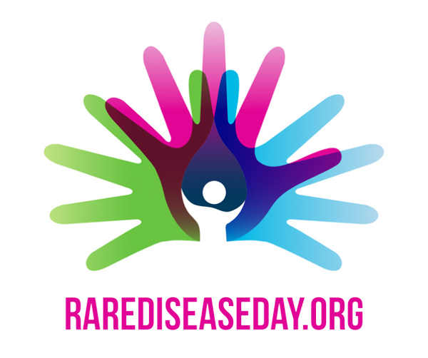 Image: Rare Disease Day logo showing green pink and blue hands connected at the palm with white background.