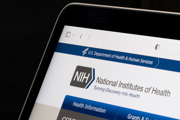 Screenshot of the National Institutes of Health (NIH) website on a laptop.