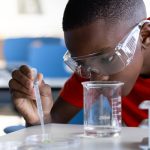 High school student conducting research in chemistry.