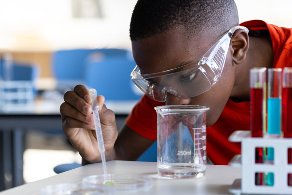 High school student conducting research in chemistry.