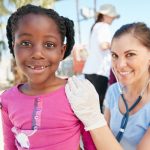 Community Health Worker (CHW) and patient smiling.