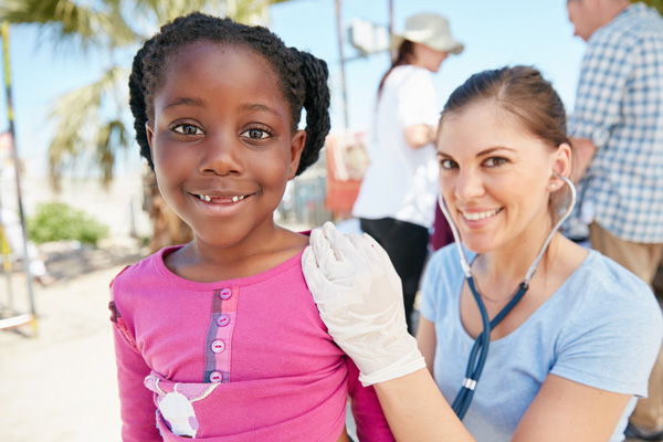 Community Health Worker (CHW) and patient smiling.