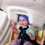 Baby smiling while being scanned in MEG Brain Imaging Technology