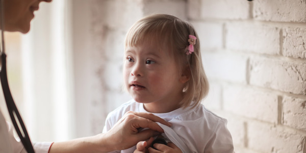 Young child being examined by a doctor.