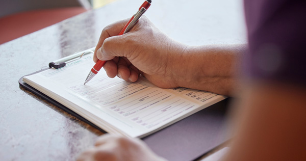 Person completing a form.