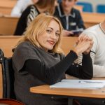 College student in class sitting in a wheelchair.