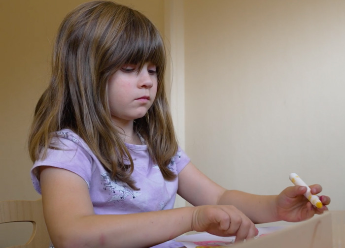 Young child drawing.