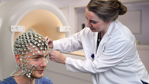 Researcher conducting a brain image scan.