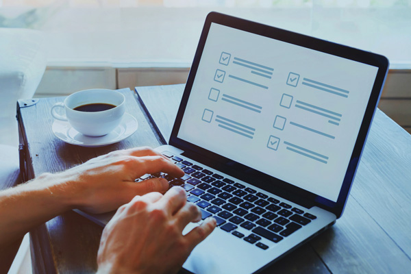 Person participating in a survey on a computer.