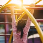 Young child playing on a playground.