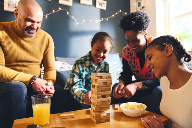 Family playing Jenga together.