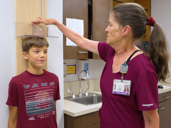 Patient and clinician in an IHDD Specialty Clinic.