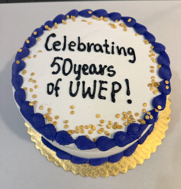 Cake with 'Celebrating 50 Years of UWEP' written on it.