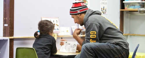 Photo of a Haring Center student teacher working with a child.